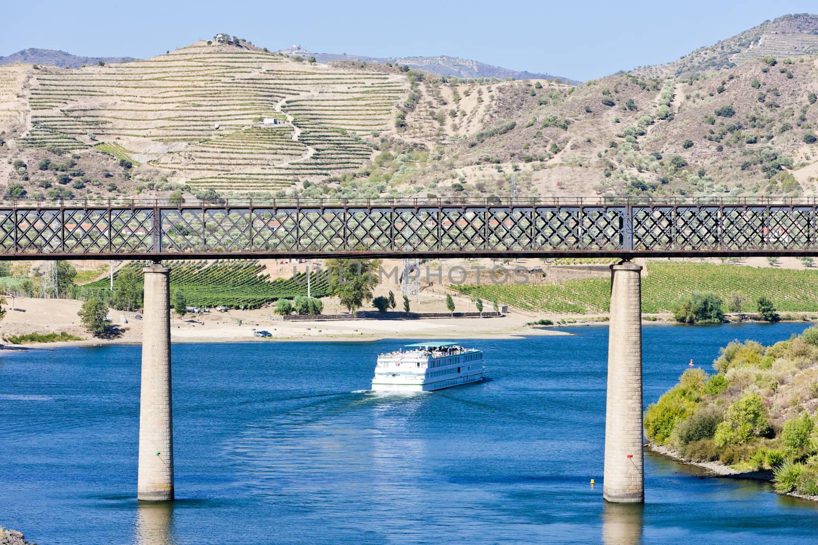 railway viaduct and cruise ship in Pocinho, Douro Valley, Portugal