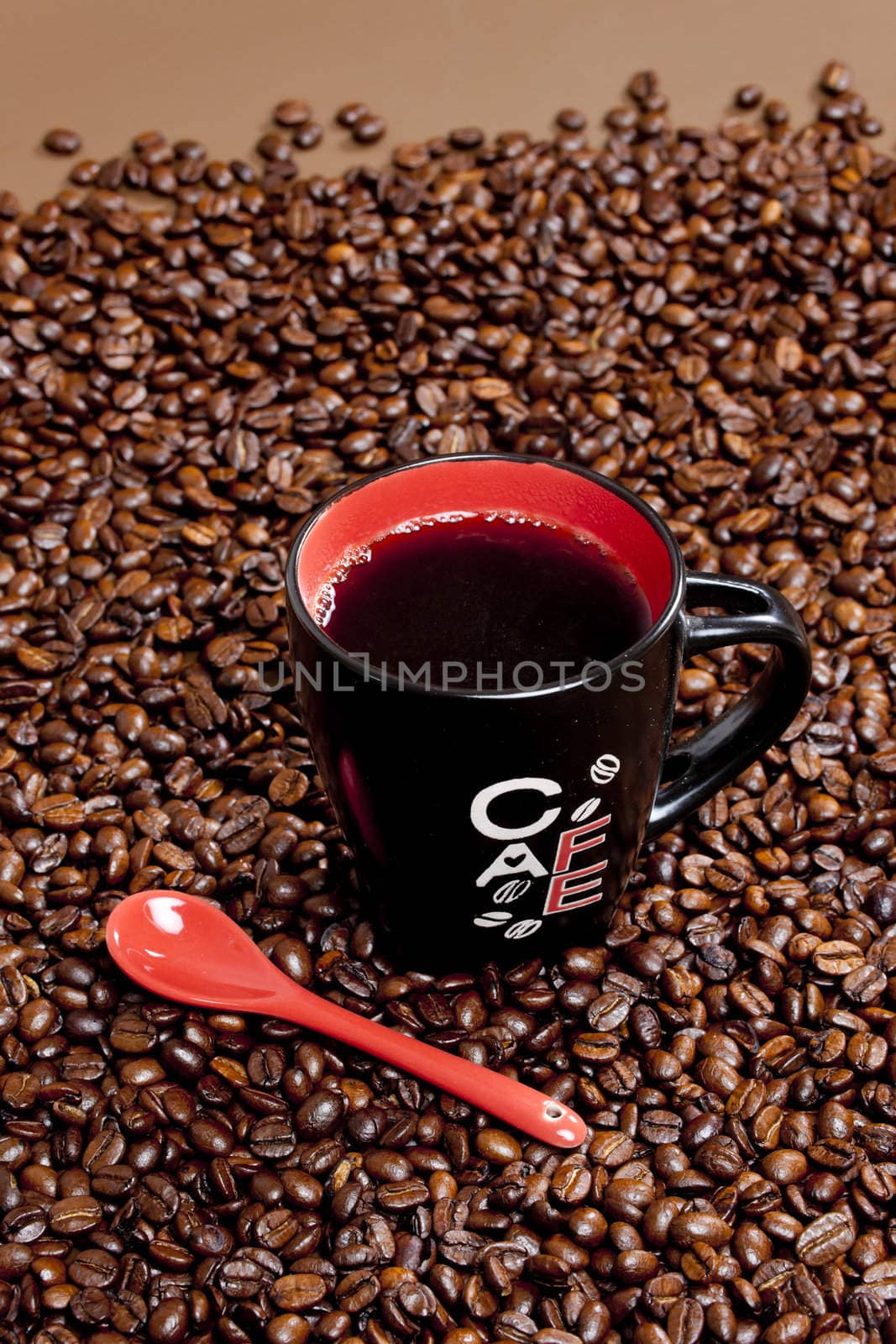 cup of coffee with coffee beans