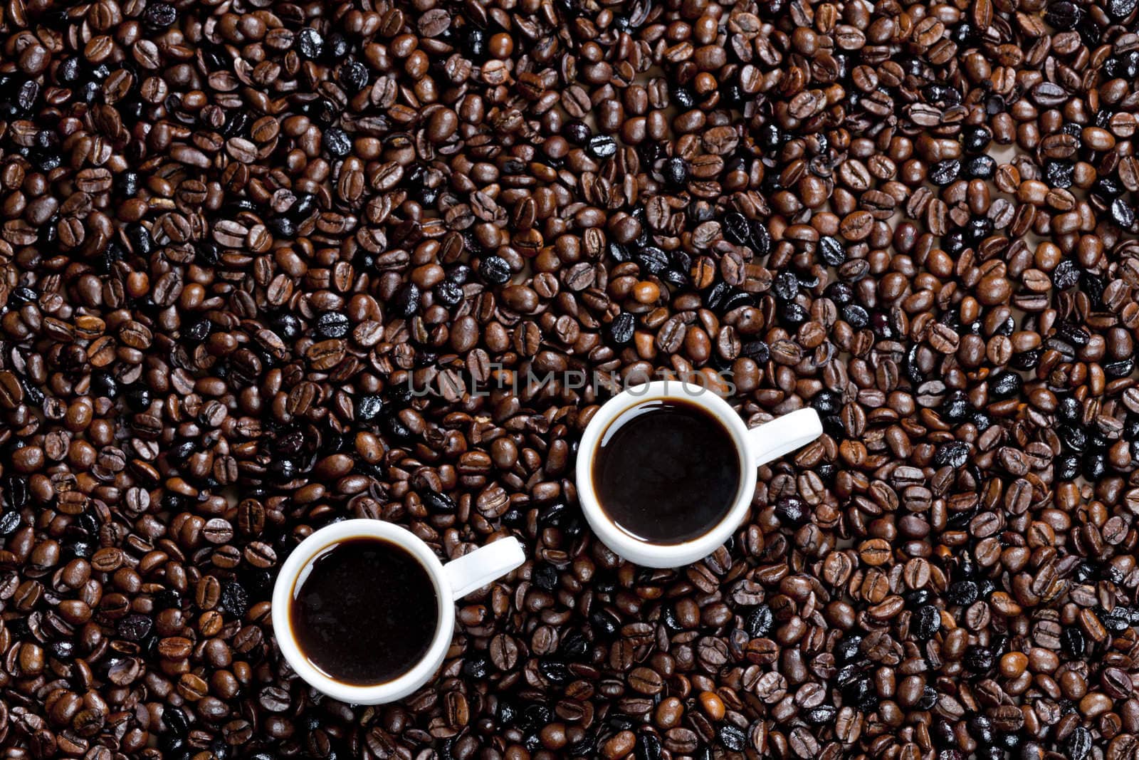 still life of coffee cups and coffee beans