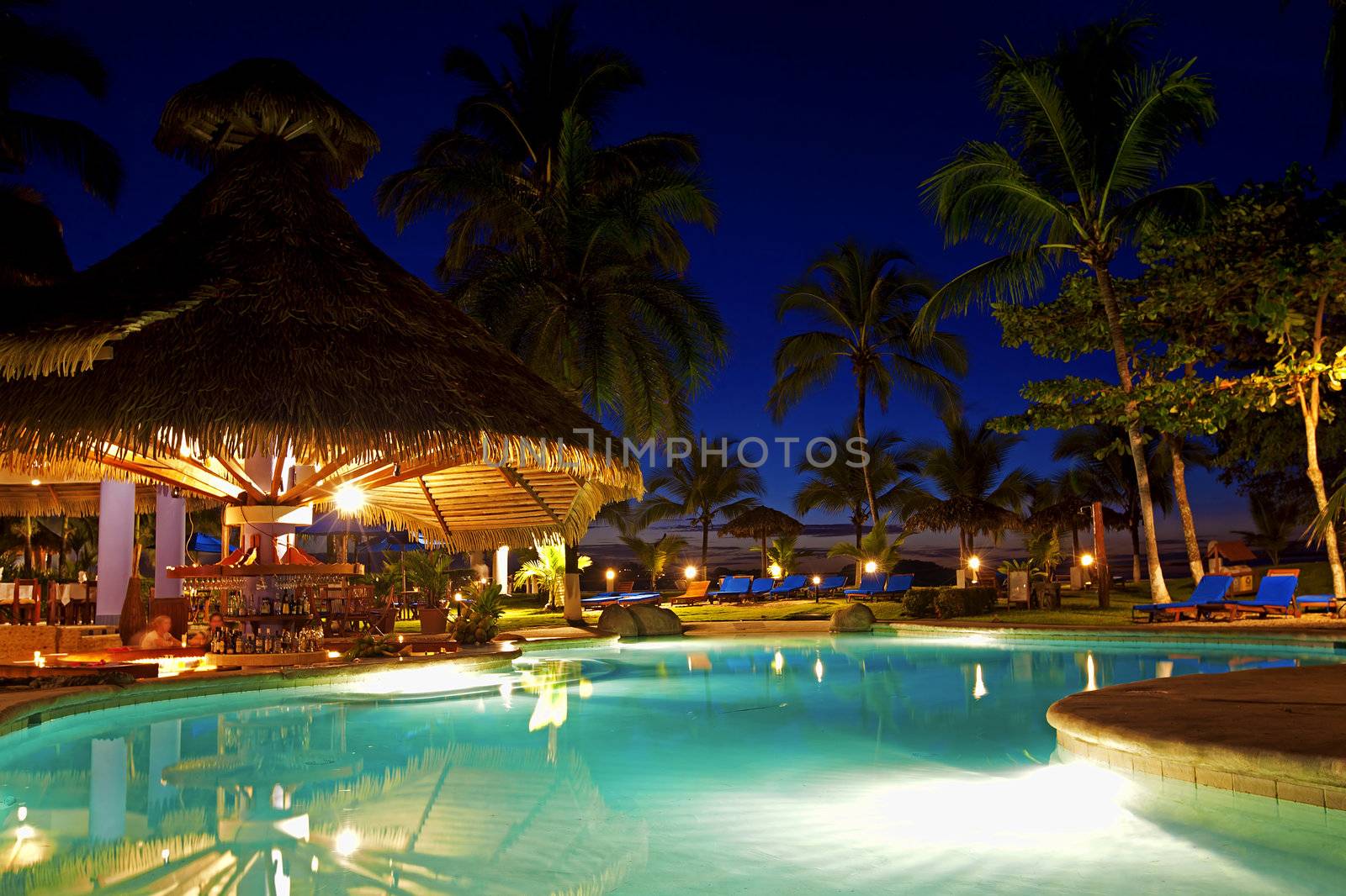 Evening picture of the swimming pool area on a resort