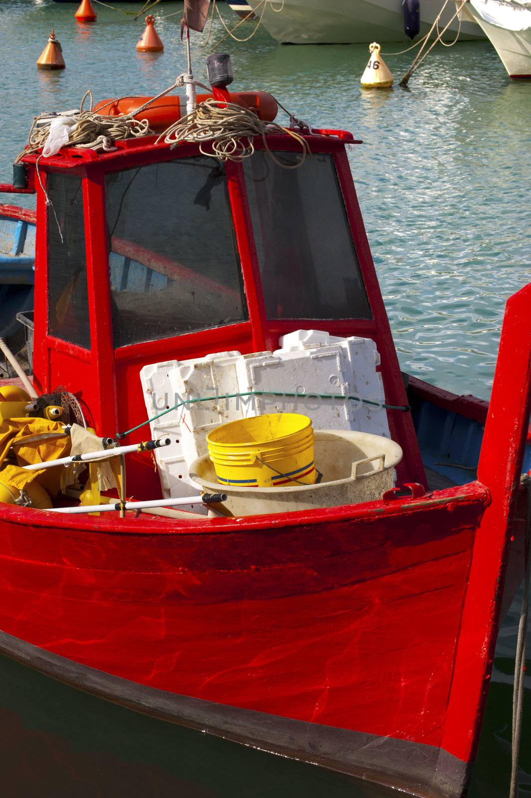 Red small fishing boat docked in port - Italy Lerici