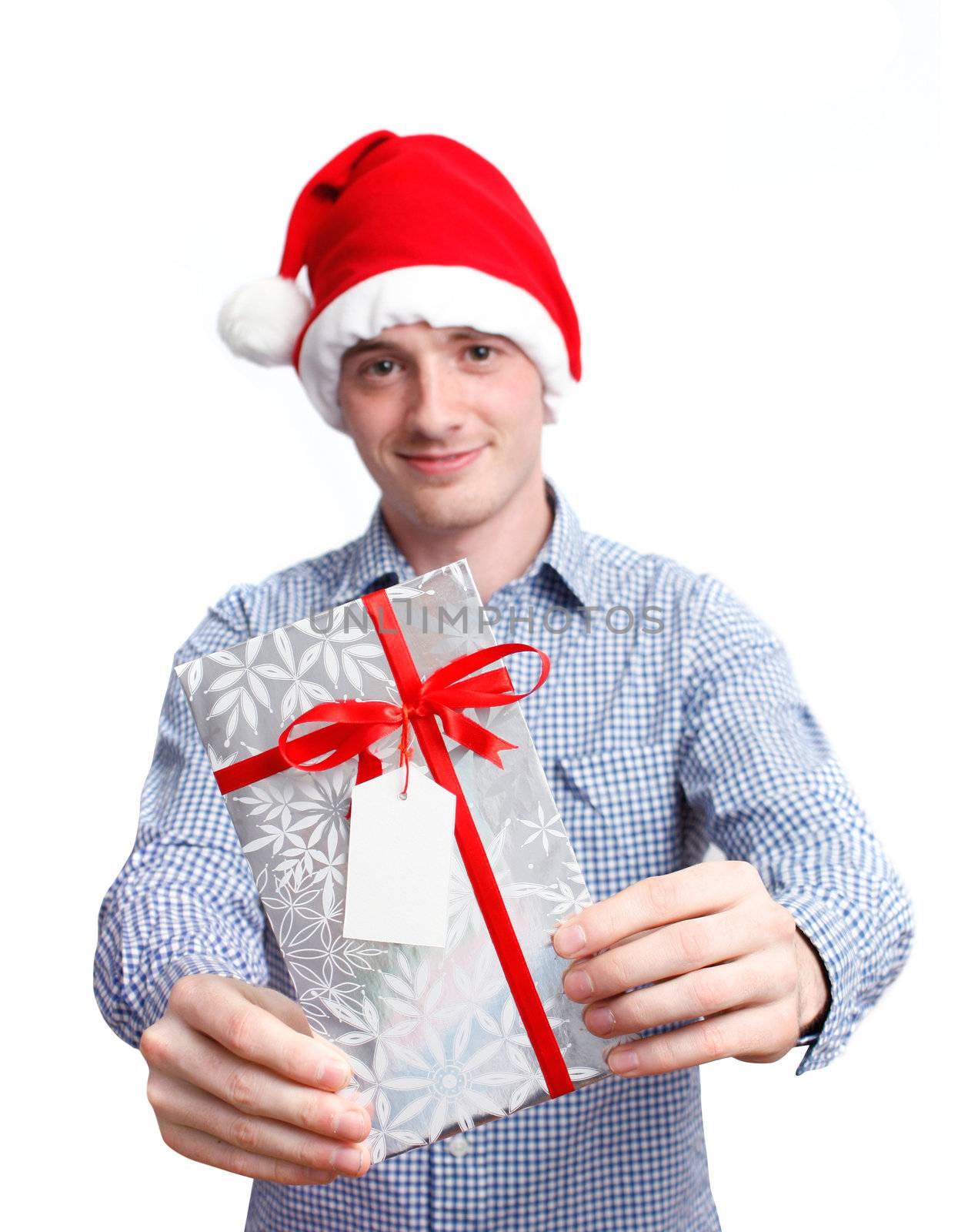 Man with santa hat holding christmas present by leeser