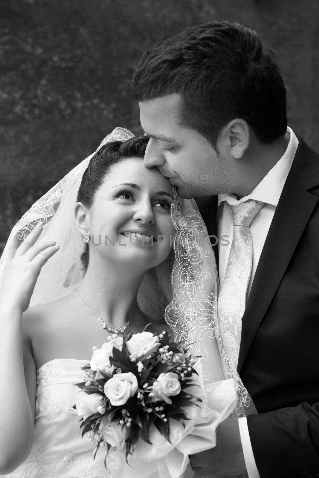 Newly-married couple in park