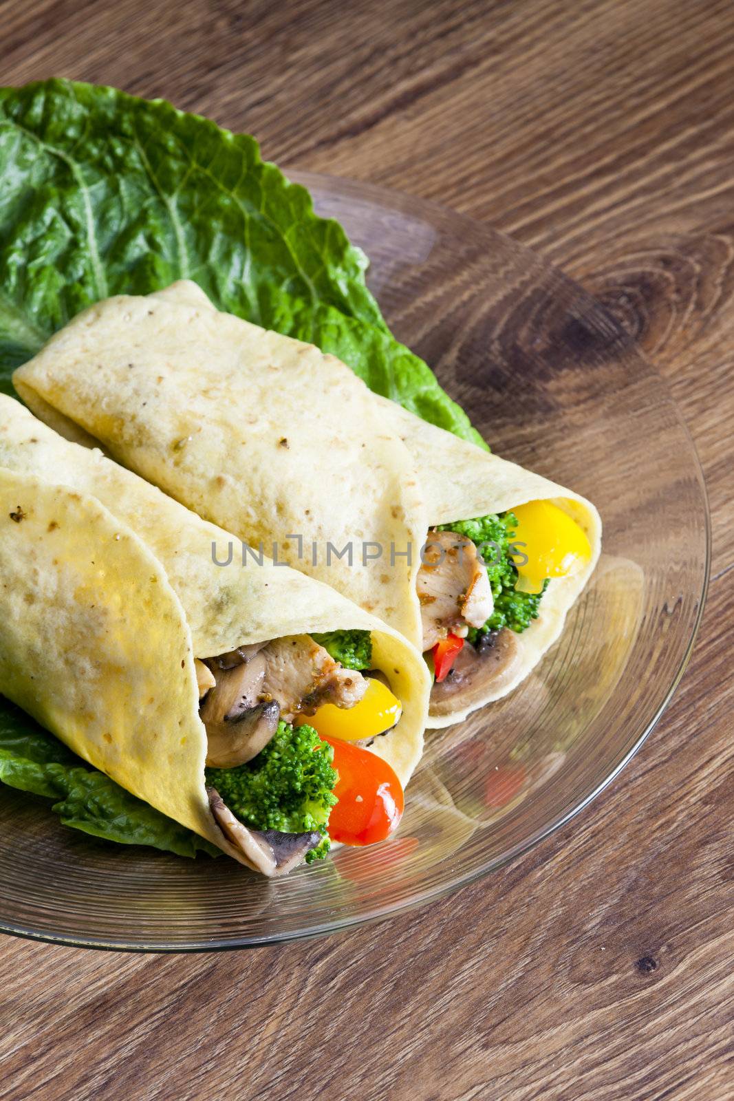 tortilla filled with chicken meat and vegetables