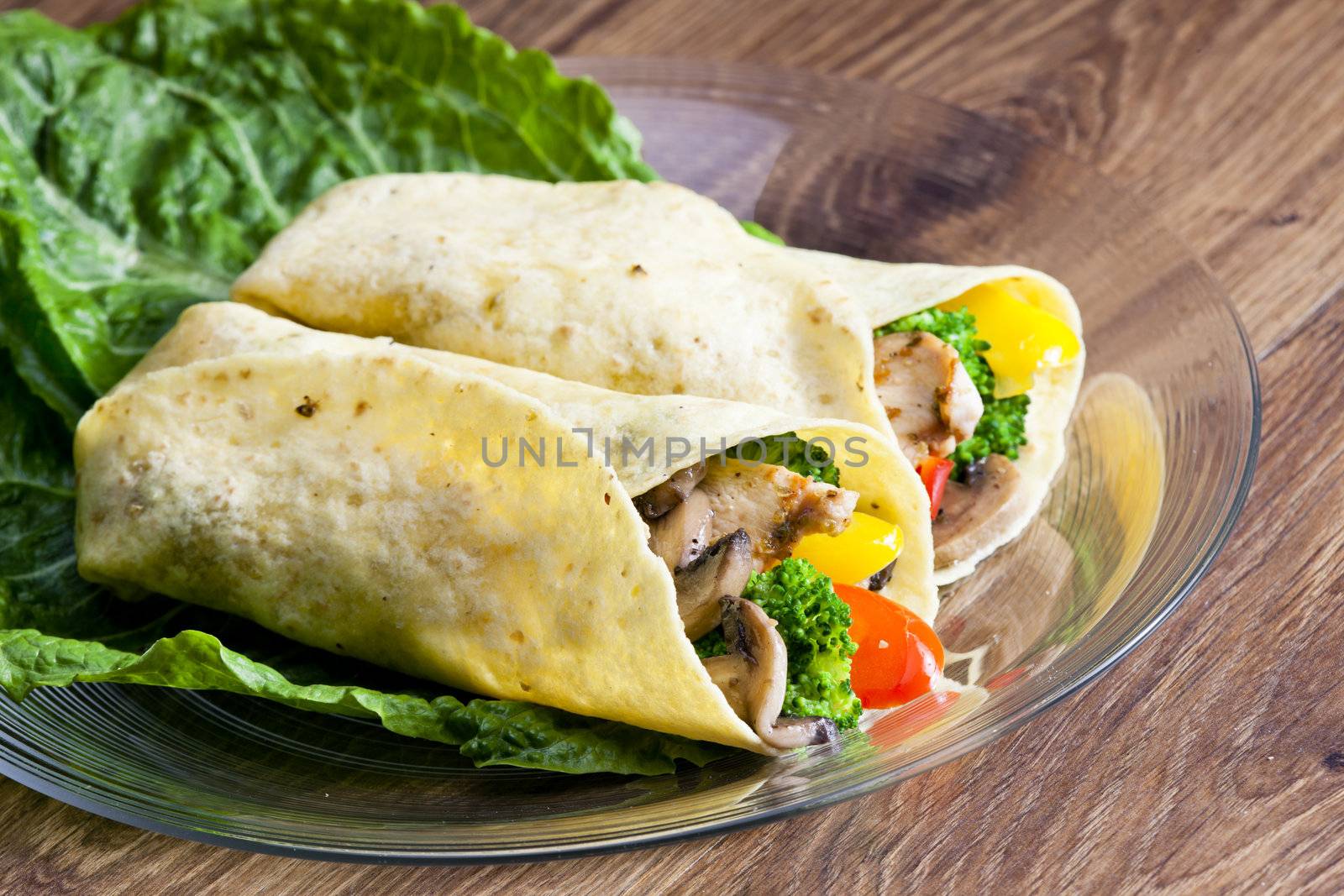 tortilla filled with chicken meat and vegetables