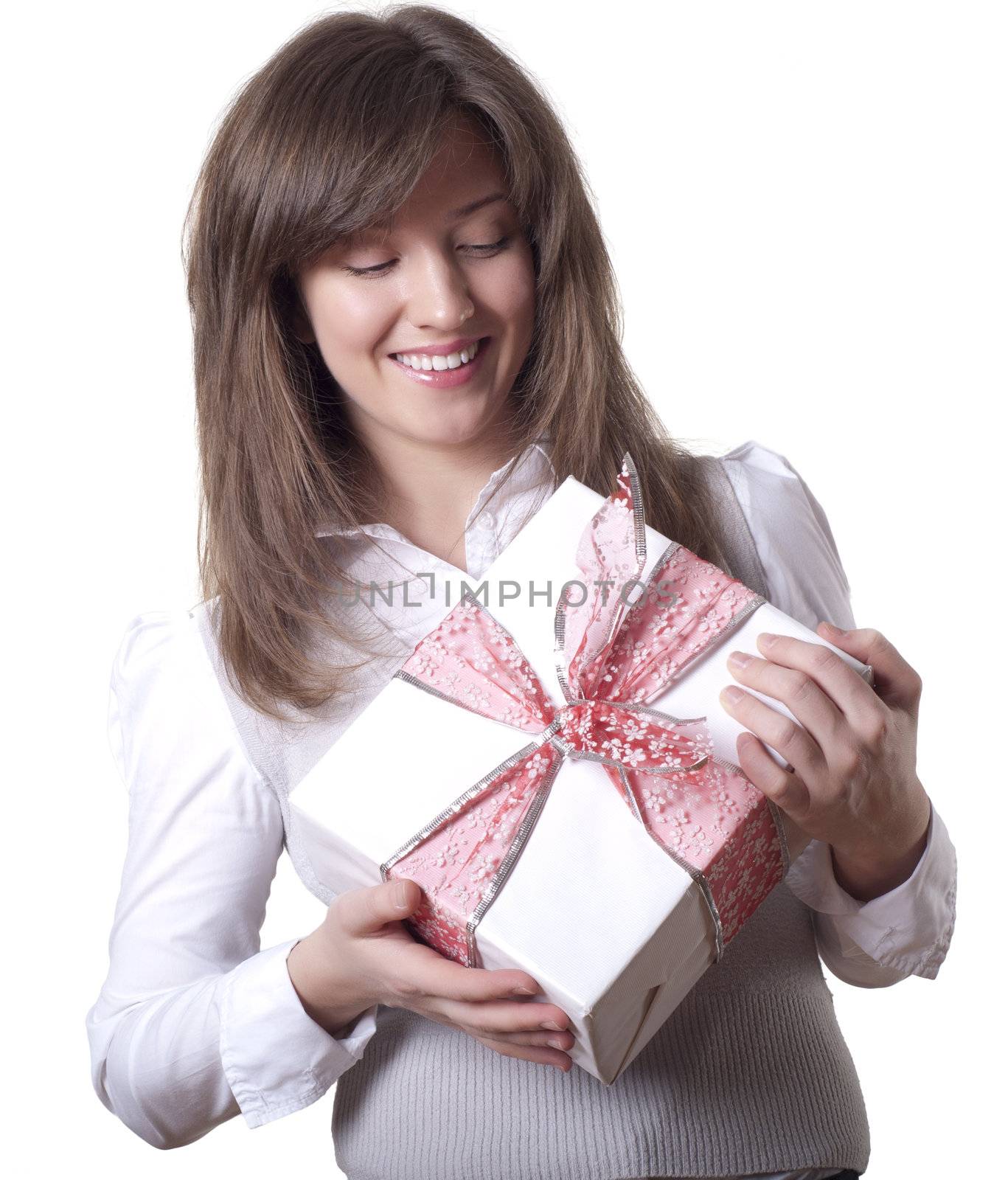 Young smiling woman holding gift - light box with a bow