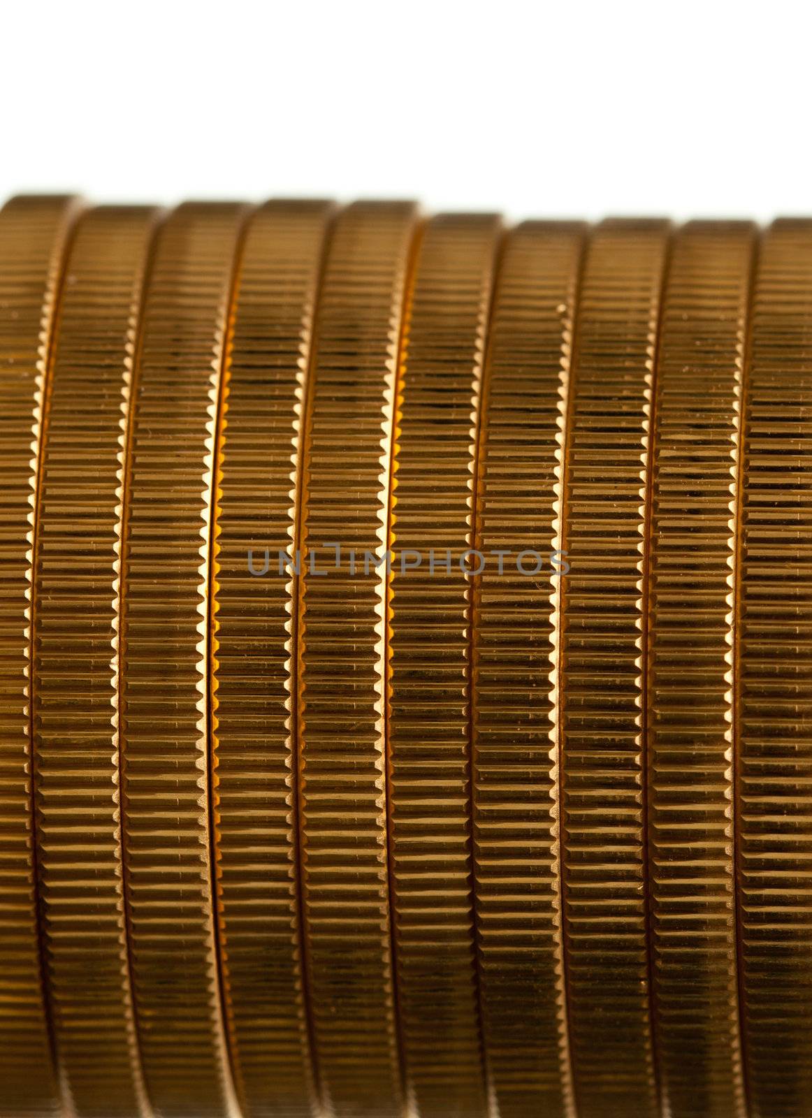 Gold Eagle one ounce coins in a stack and isolated against white