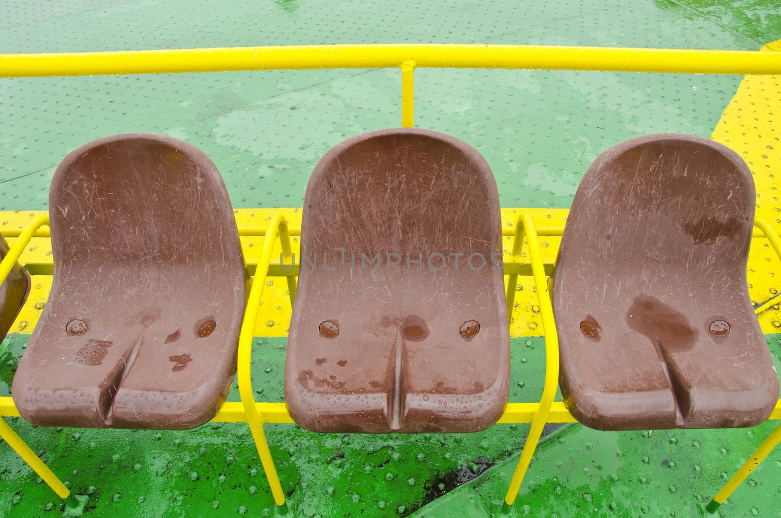 Brown plastic seats of ferry. Passenger nautical transportation. by sauletas