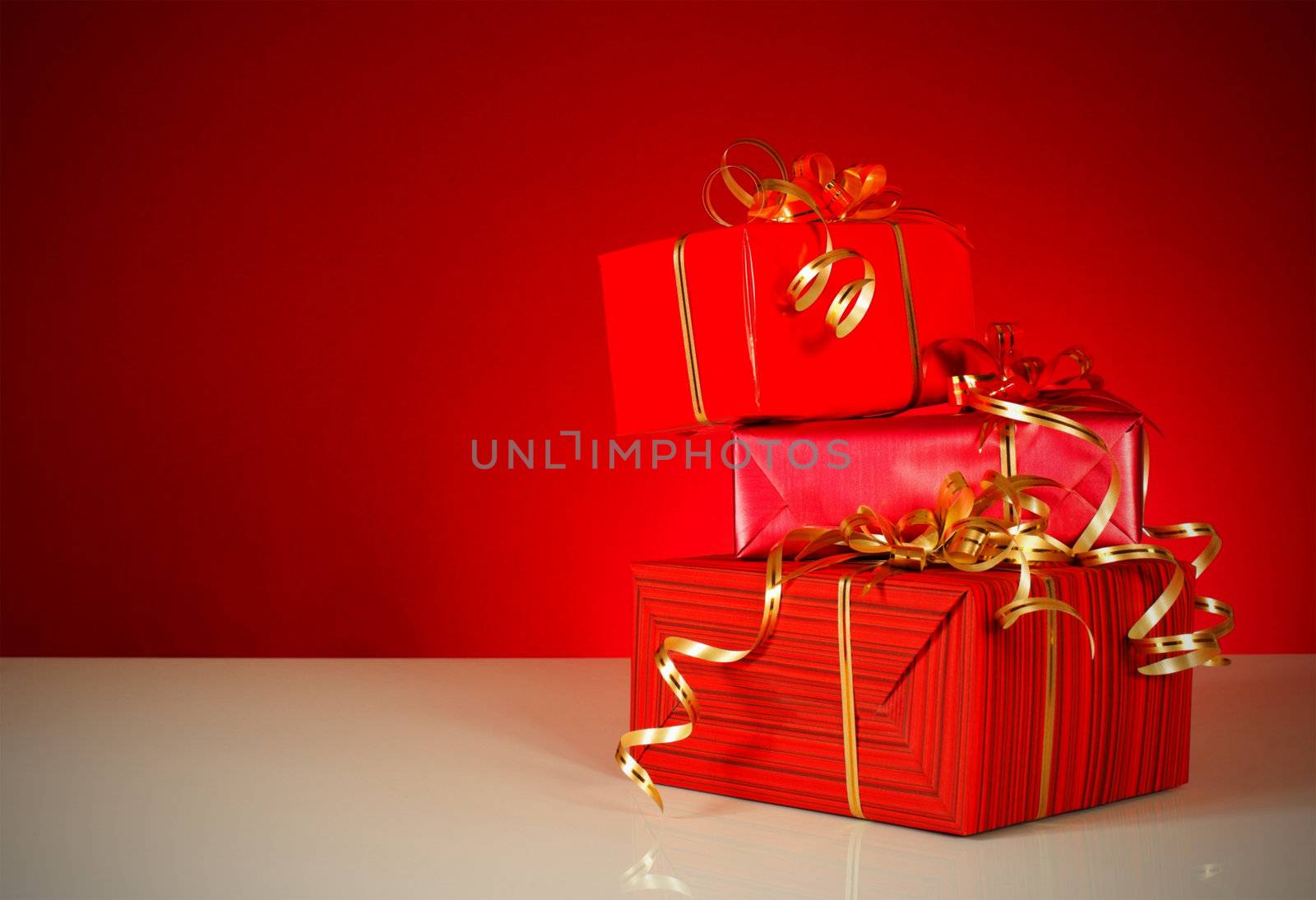 Christmas gifts over red background