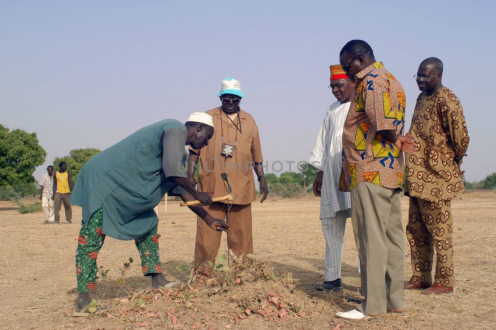 African waterfinder with work in an area of Burkina Faso Faso. Water is not rare in Africa, only it is necessary to drill wells to reach it. The waterfinder thus determines the place exact where to drill because drilling costs 8000 ? and it is not question of missing the place where the machines will have to work.