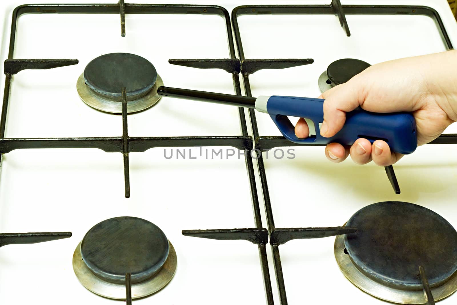 Lighter gas burner ignites the gas stove