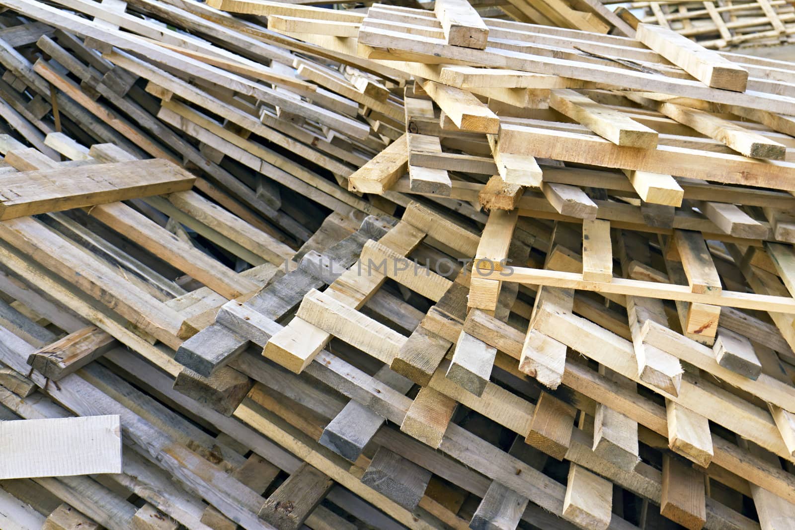 background of piled up in a pile of wooden pallets