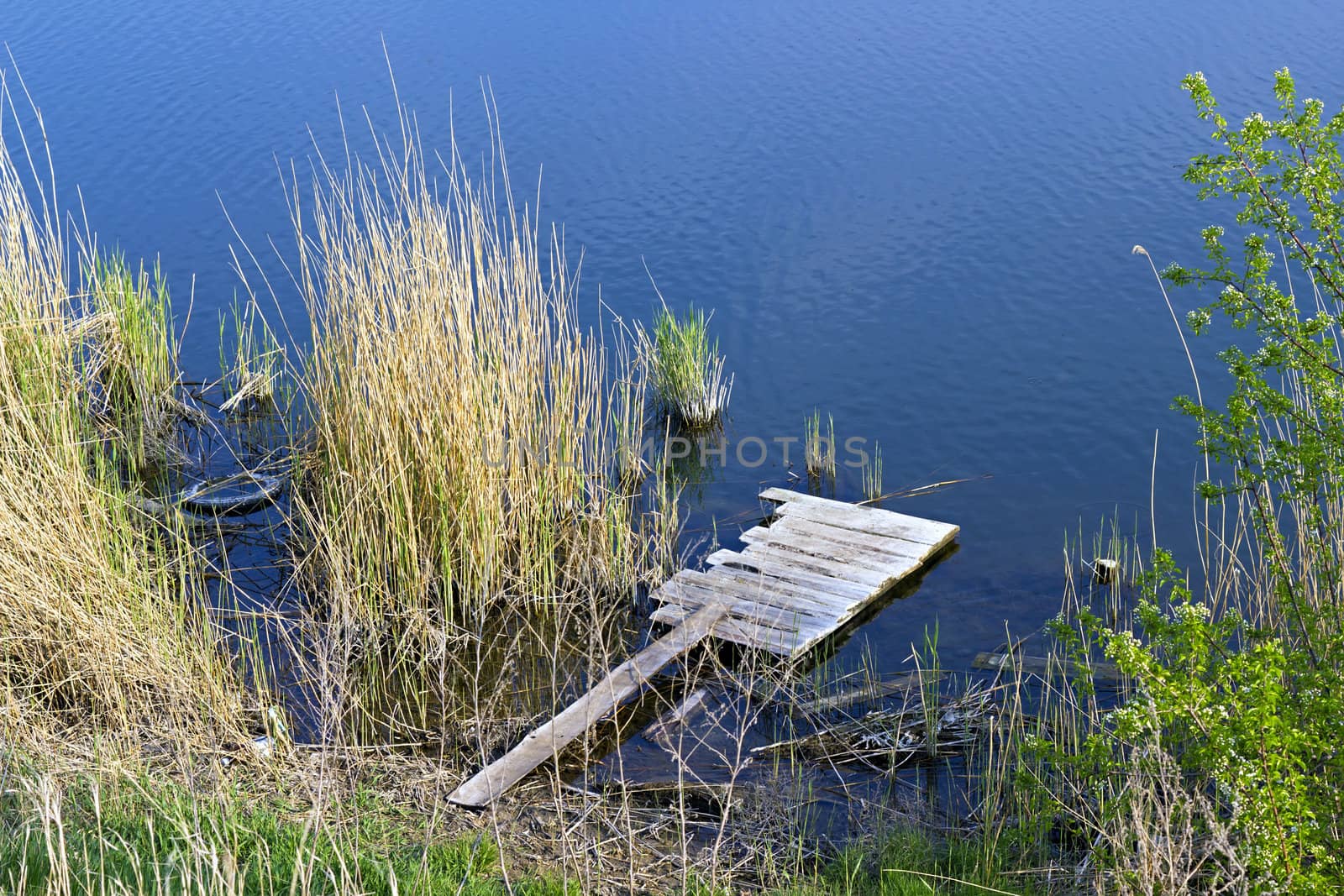 homemade wooden platform on the river