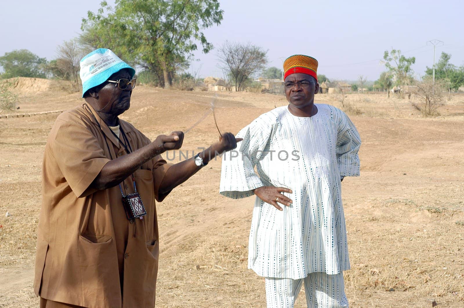 African waterfinder with work in an area of Burkina Faso Faso. Water is not rare in Africa, only it is necessary to drill wells to reach it. The waterfinder thus determines the place exact where to drill because drilling costs 8000 ? and it is not question of missing the place where the machines will have to work.
