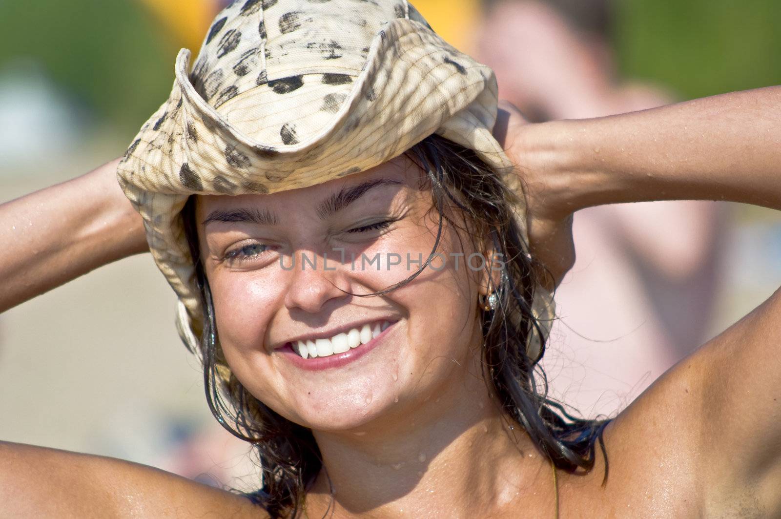 woman in a hat at the beach by Oledjio