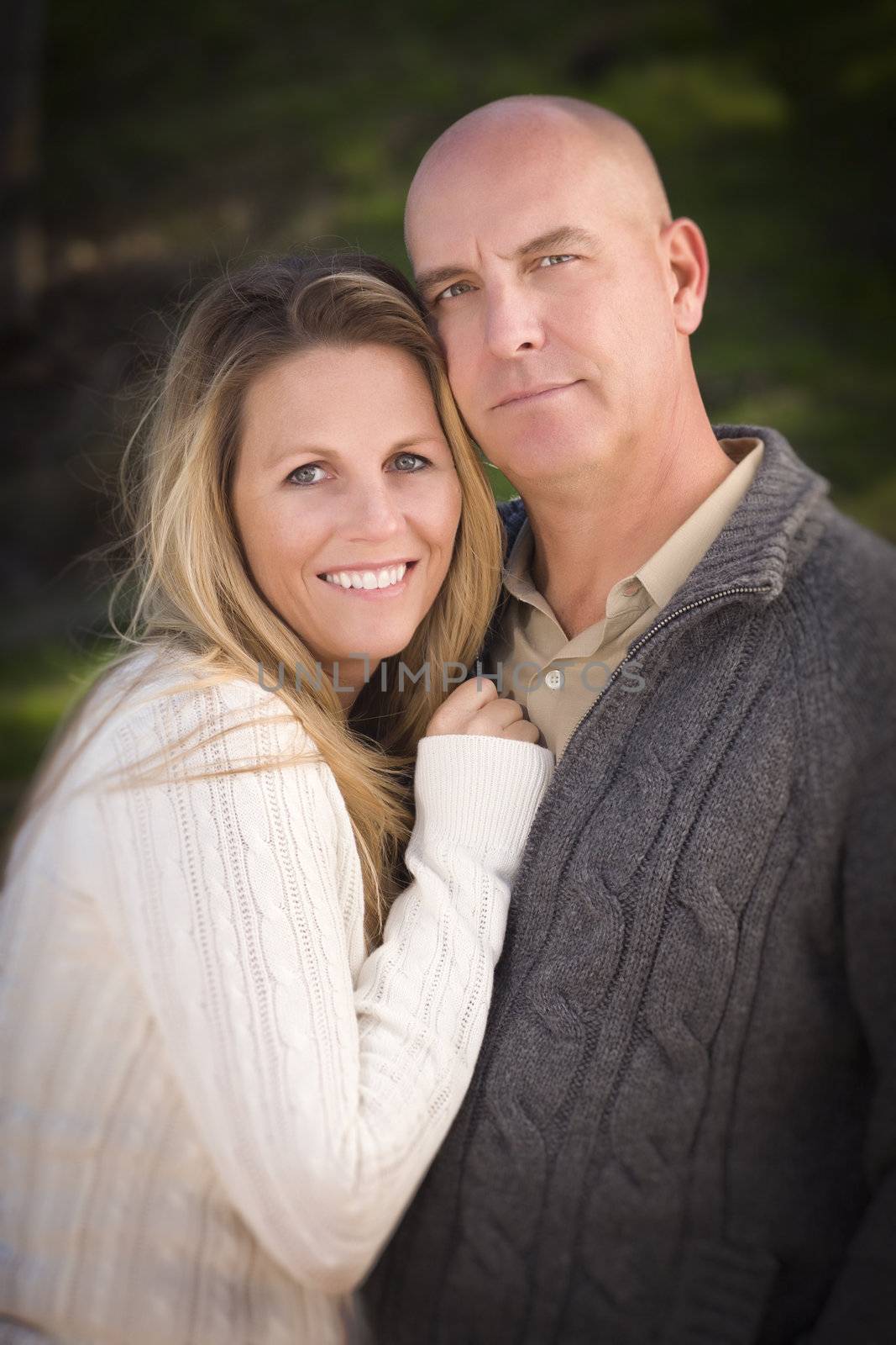 Attractive Couple Wearing Sweaters Outdoors in the Park.