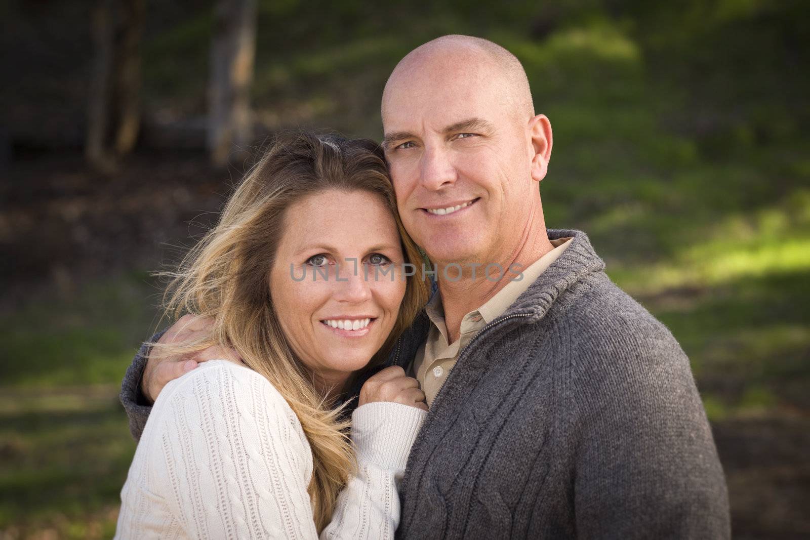 Attractive Couple Wearing Sweaters Outdoors in the Park.