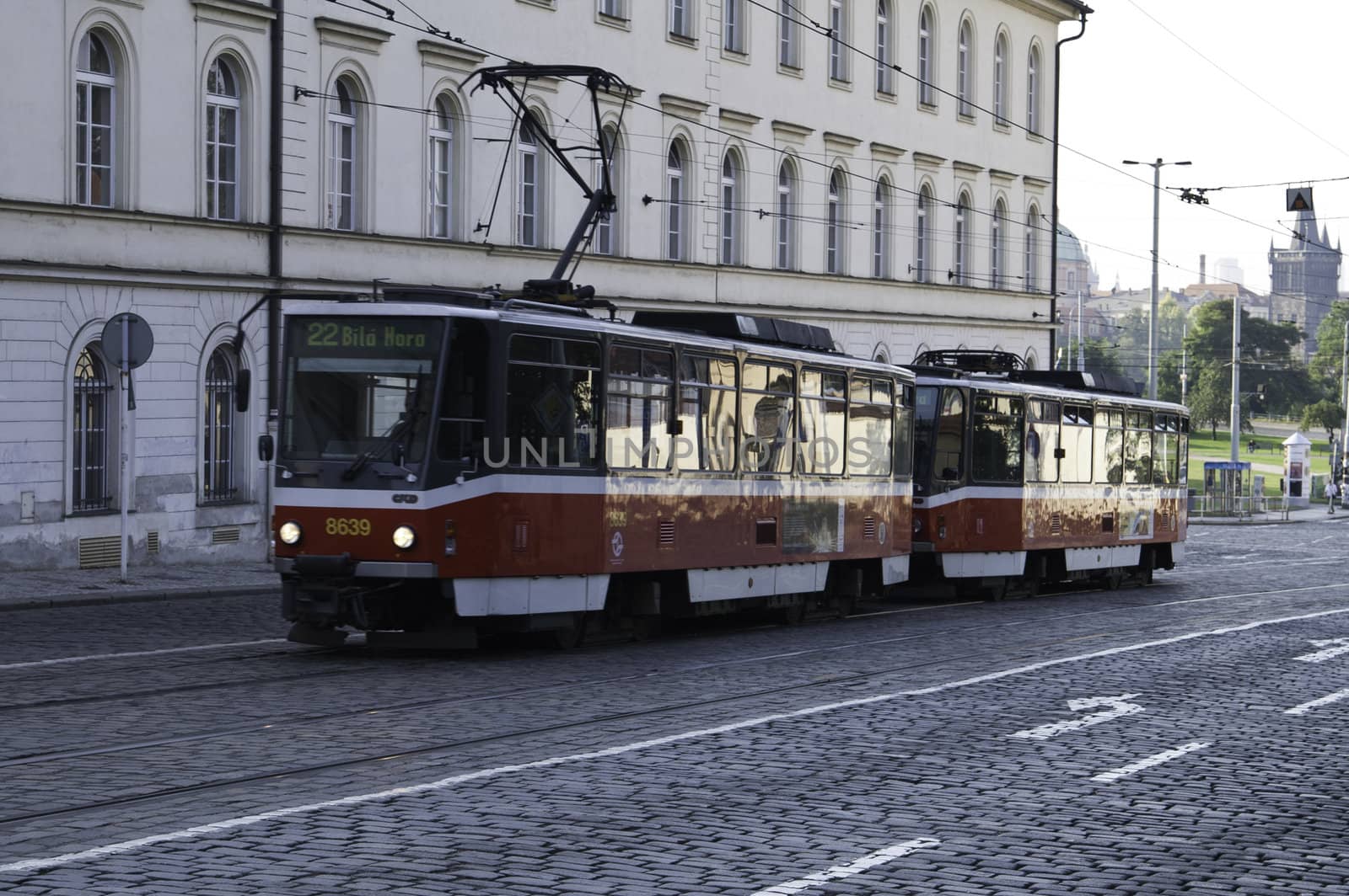 A public rail car in driving through the streets of Prague