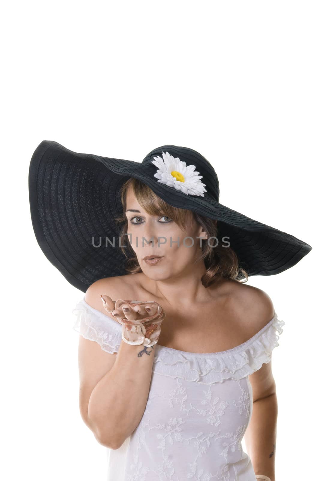Studio portrait of attractive woman in a large black hat isolated on white