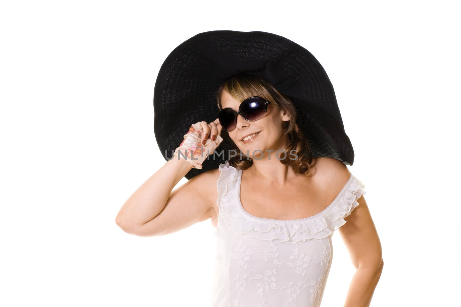 Studio portrait of attractive woman in a large black hat isolated on white
