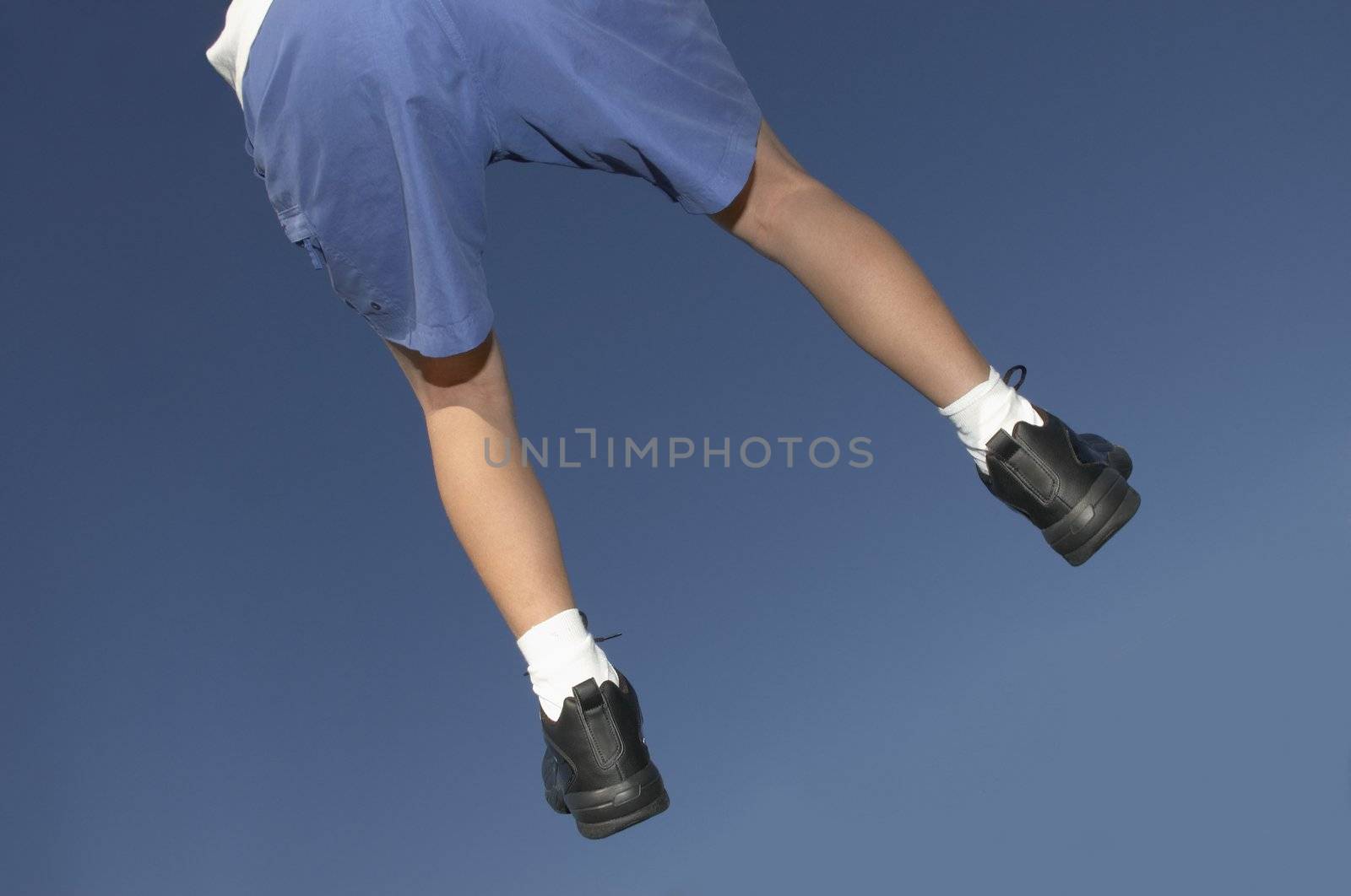 jogging shoes in air