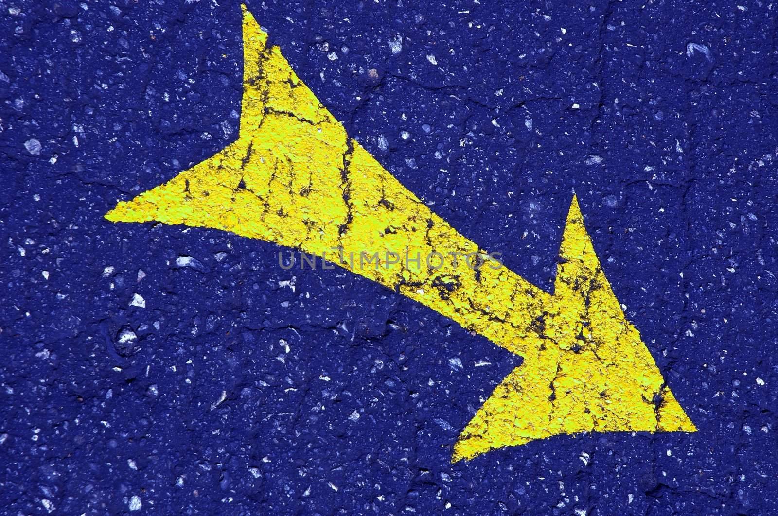 yellow arrow on the blue asphalt by Kuzma
