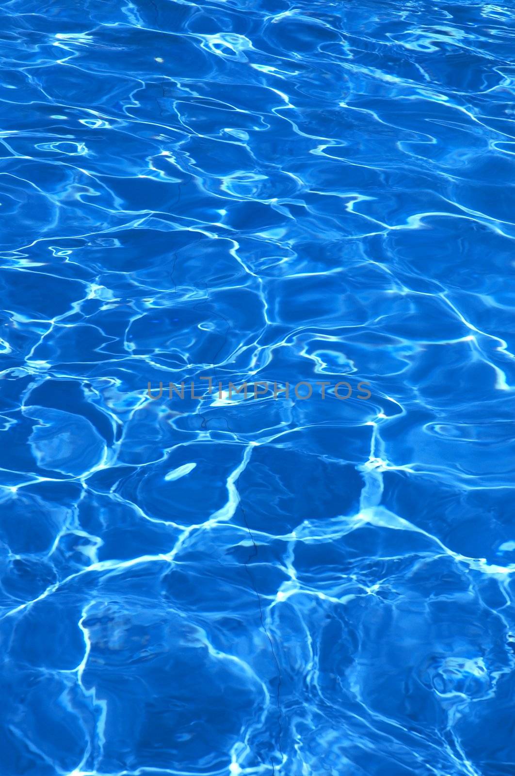 pure blue water in pool by Kuzma