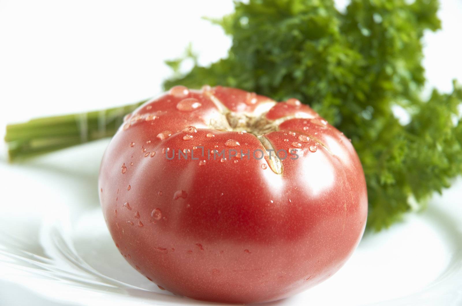 tomato and greens by Kuzma