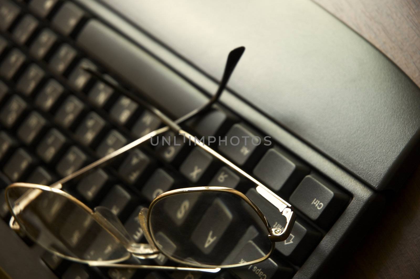black keyboard and glasses