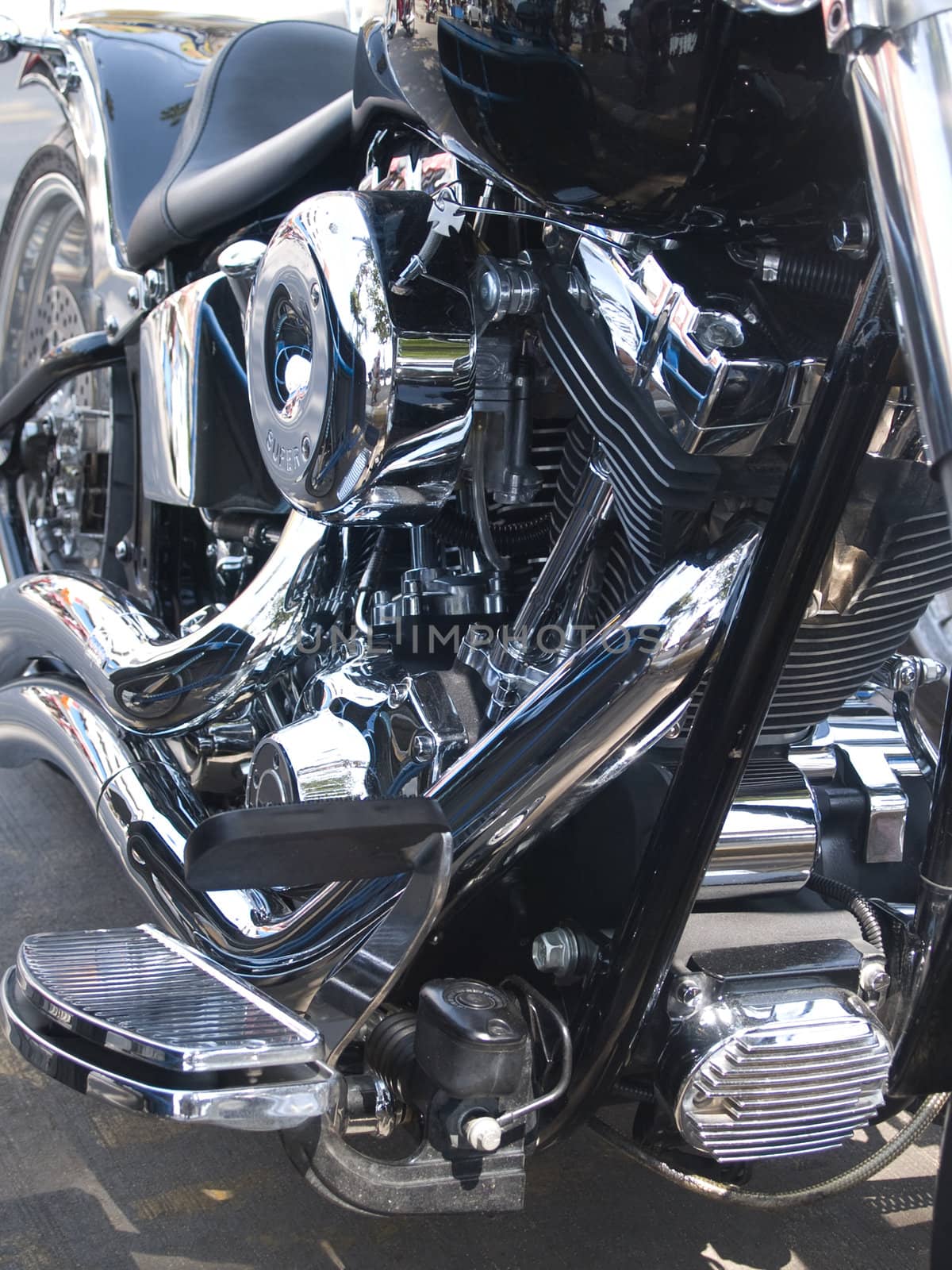 Chrome engine of custom built, heavy motorcycle with lots of chrome