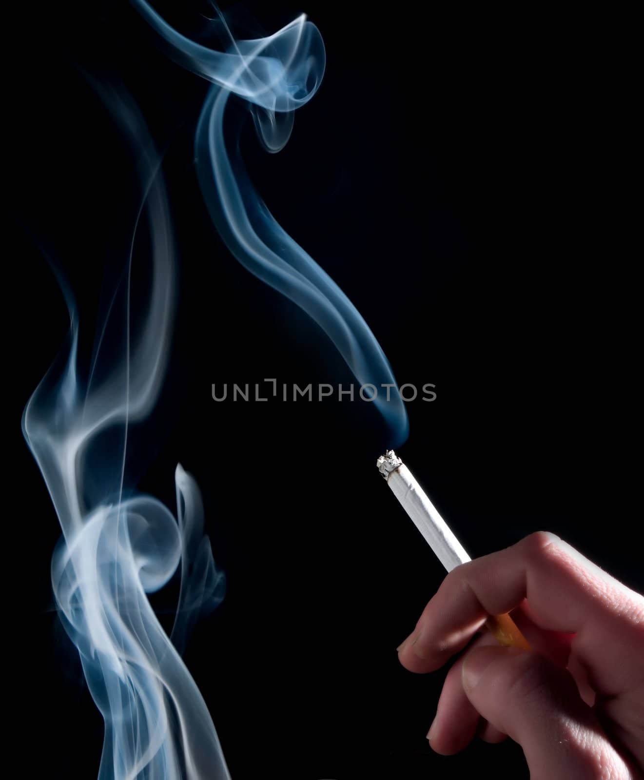 Cigarette and smoke on a black background