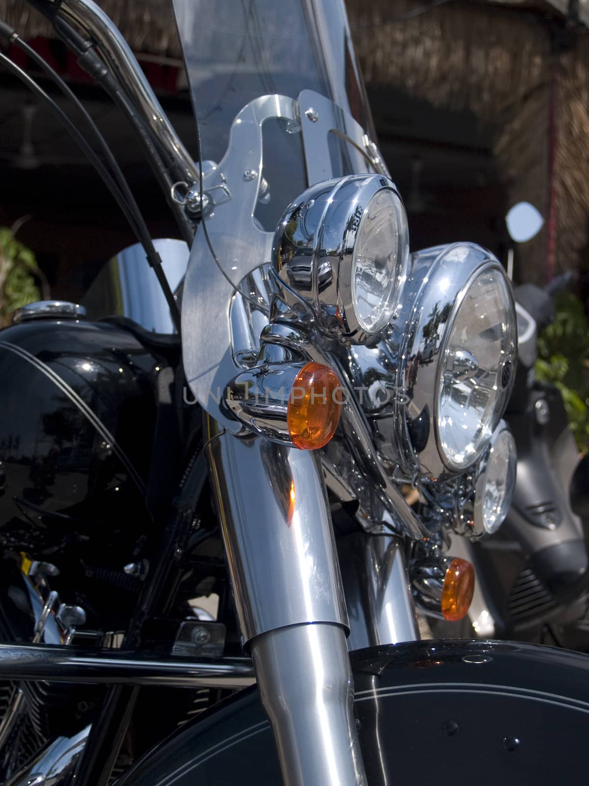 Chrome headlights of classic American motorcycle. Shallow depth of field.