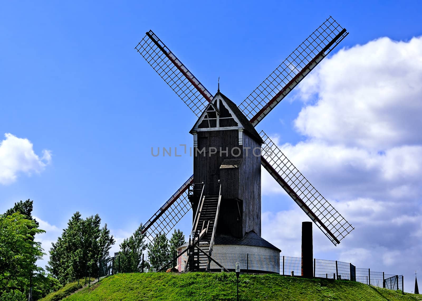 Old windmill against the sky background