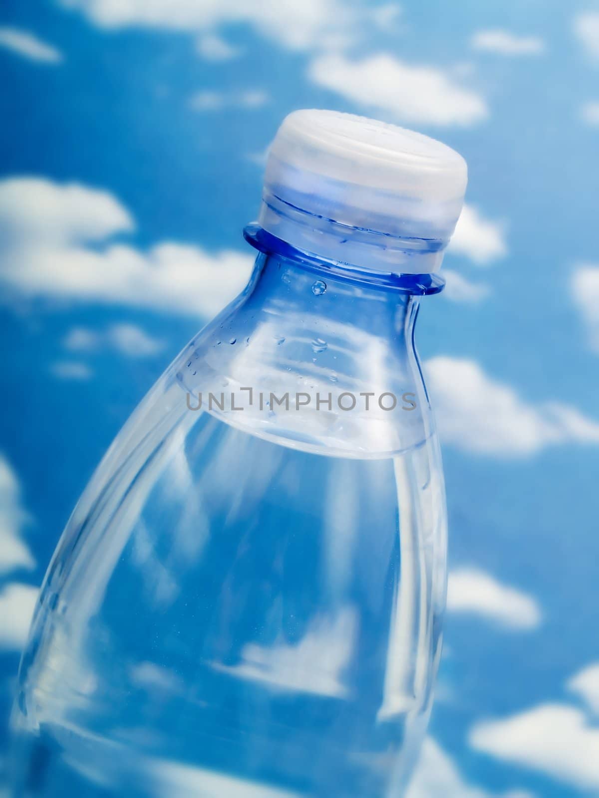 Bottle of water on a blue sky