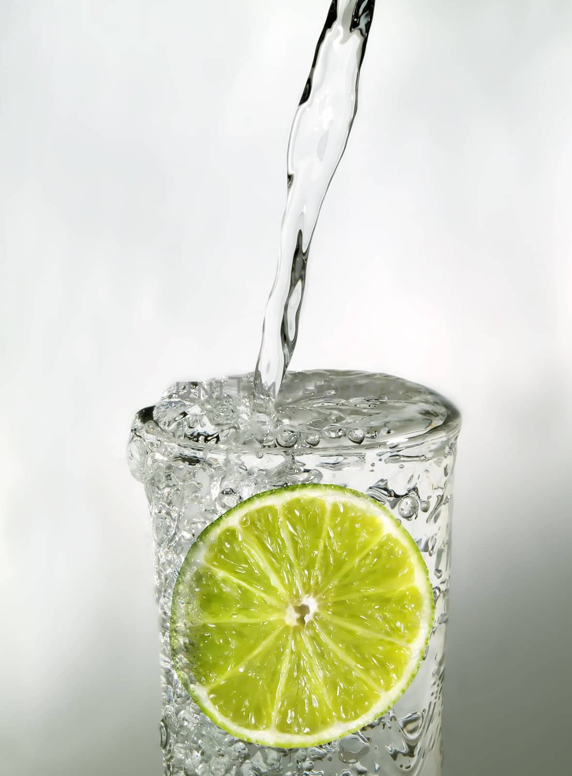 Lime slice in a glass of water