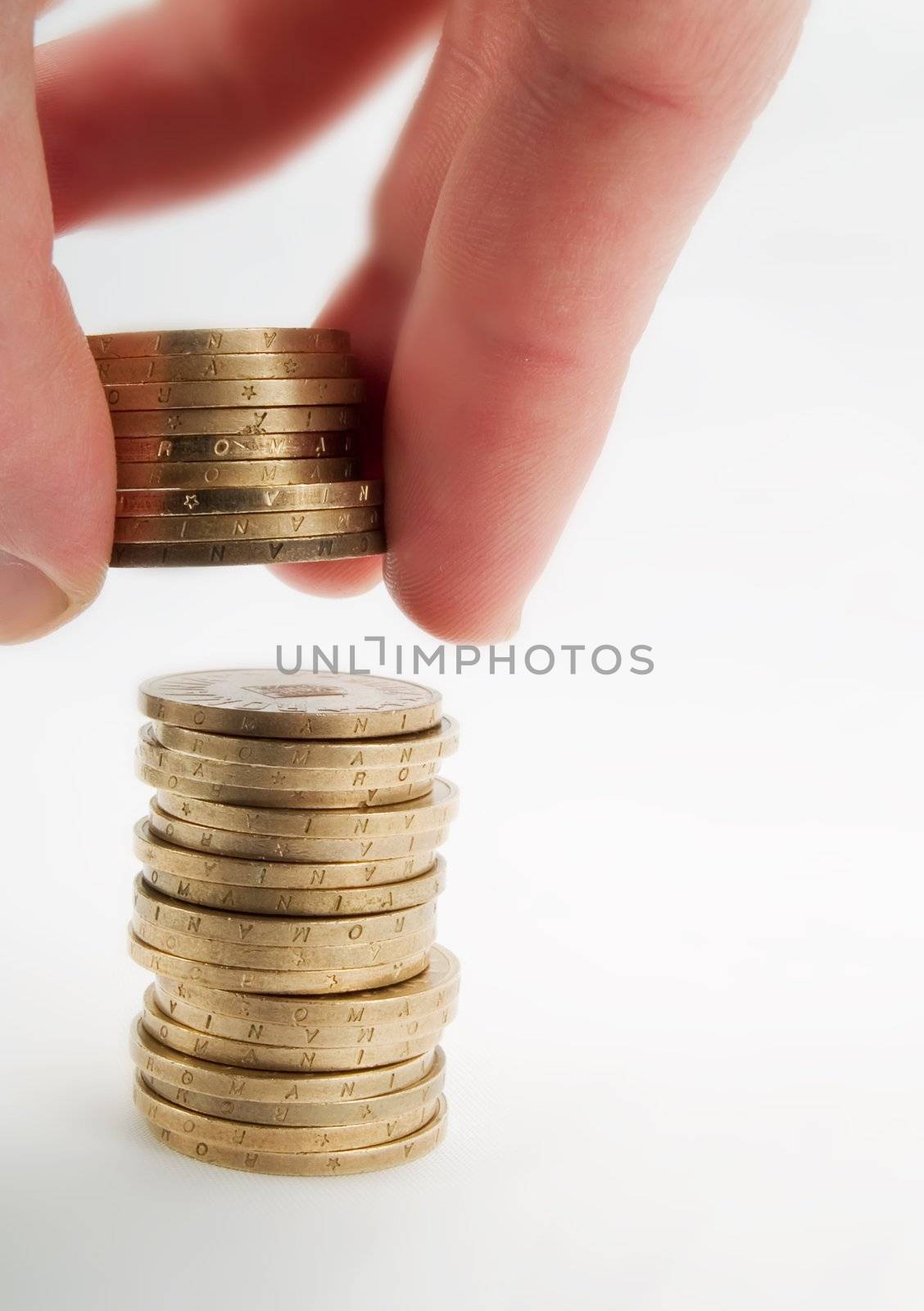 Pile of coins and hand