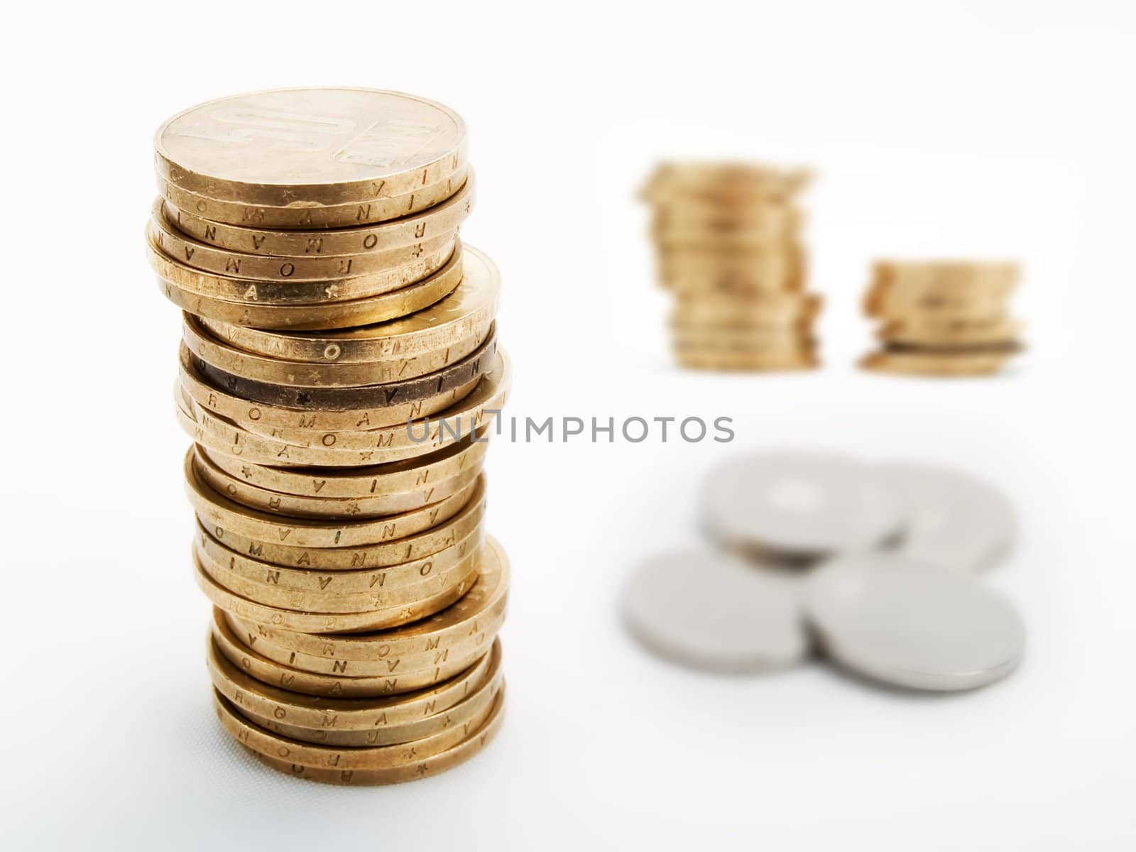 Piles of coins on a white background