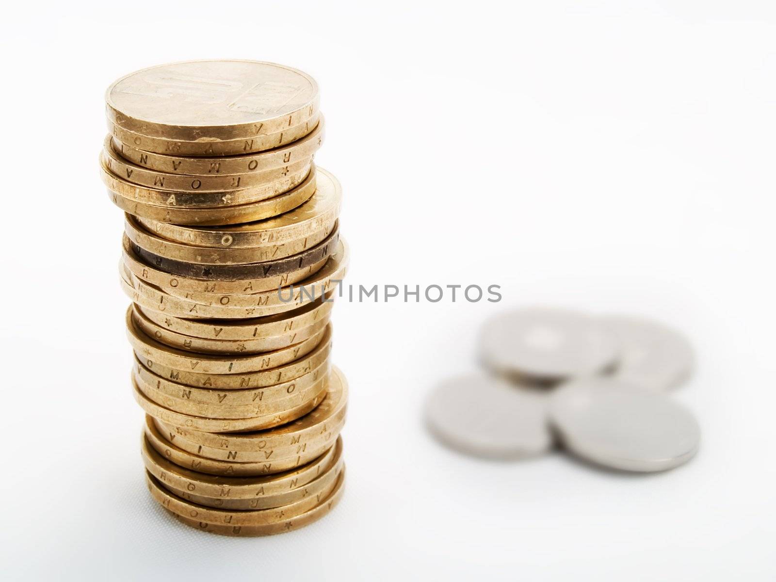 Pile of coins on a white background