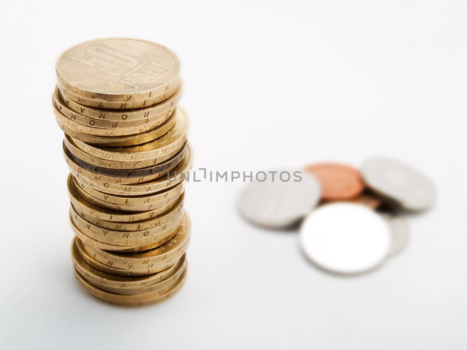 Pile of coins on a white background