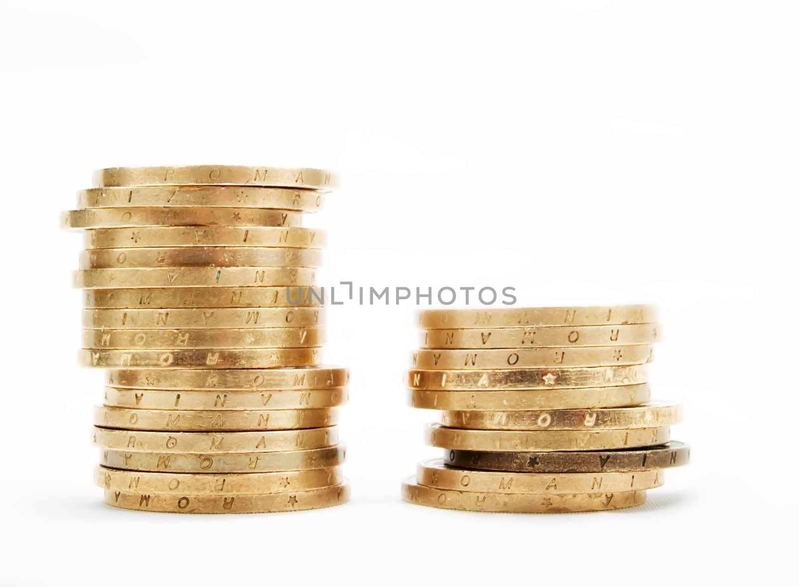 Piles of coins on a white background