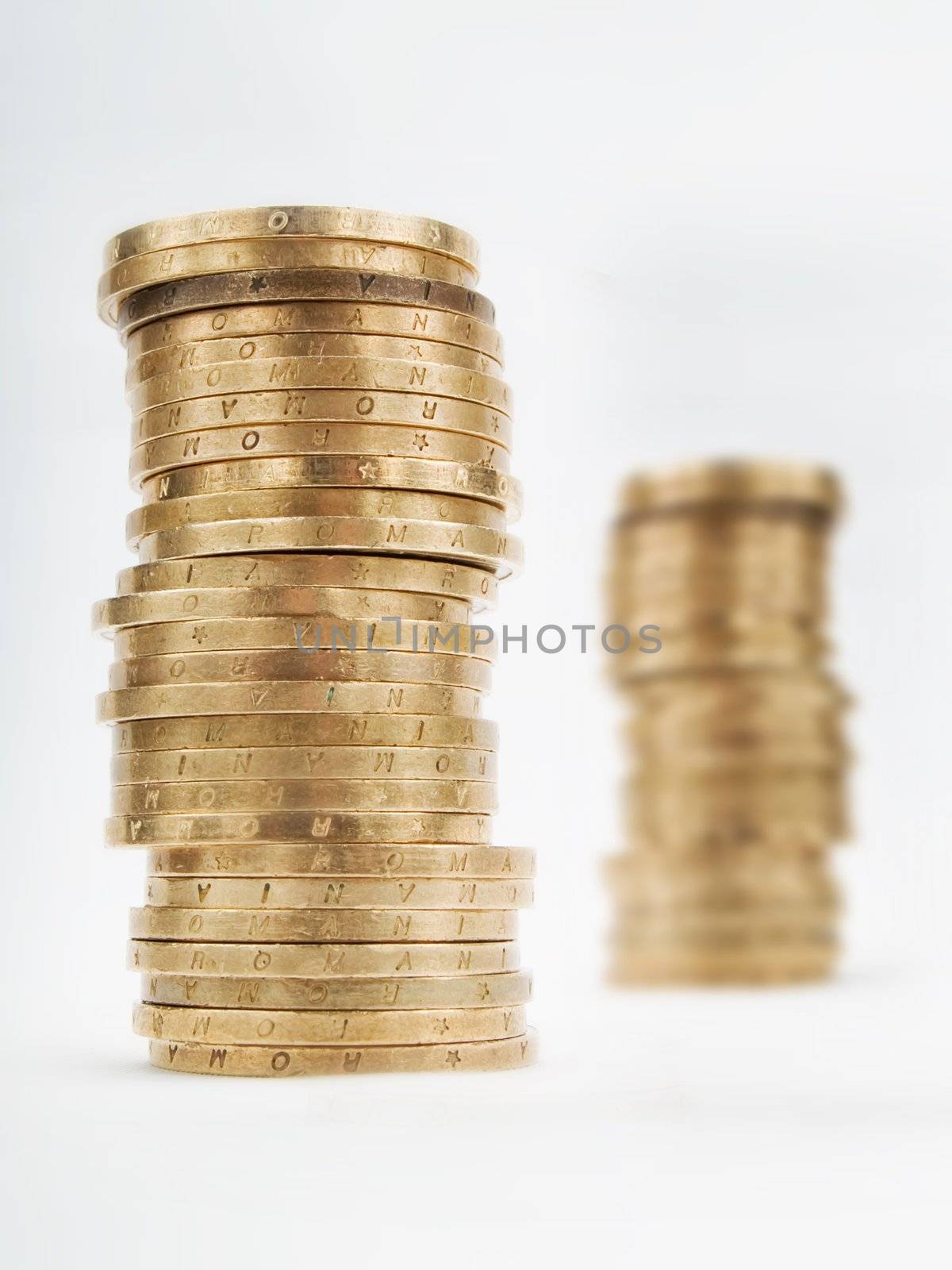 Piles of coins on a white background