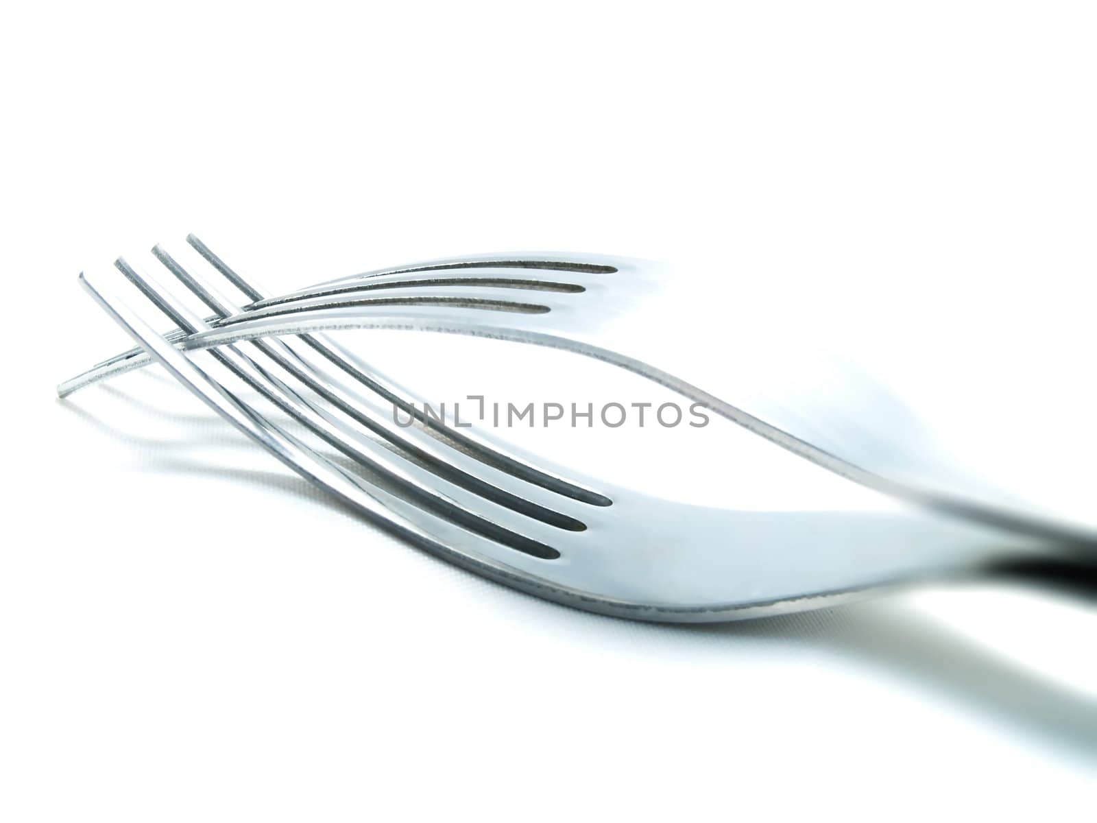 Two forks on a white background