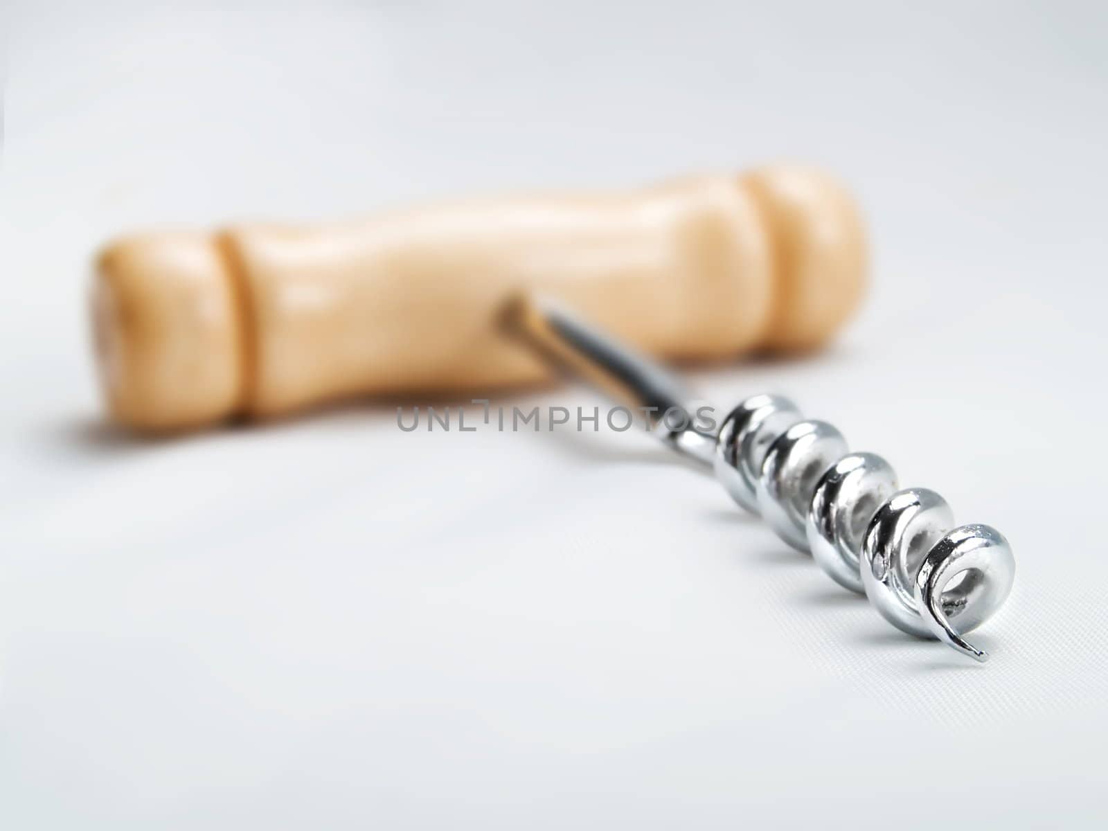 Wine corkscrew on a white background