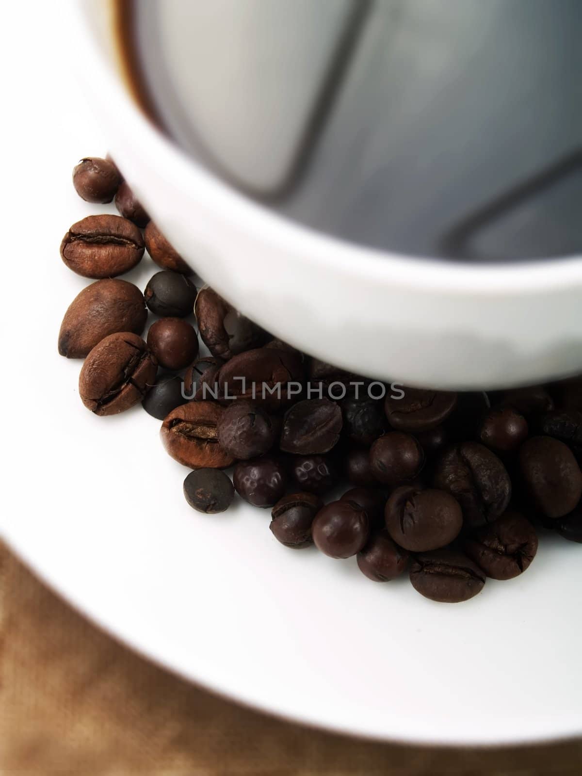 Coffee beans on a coffee cup