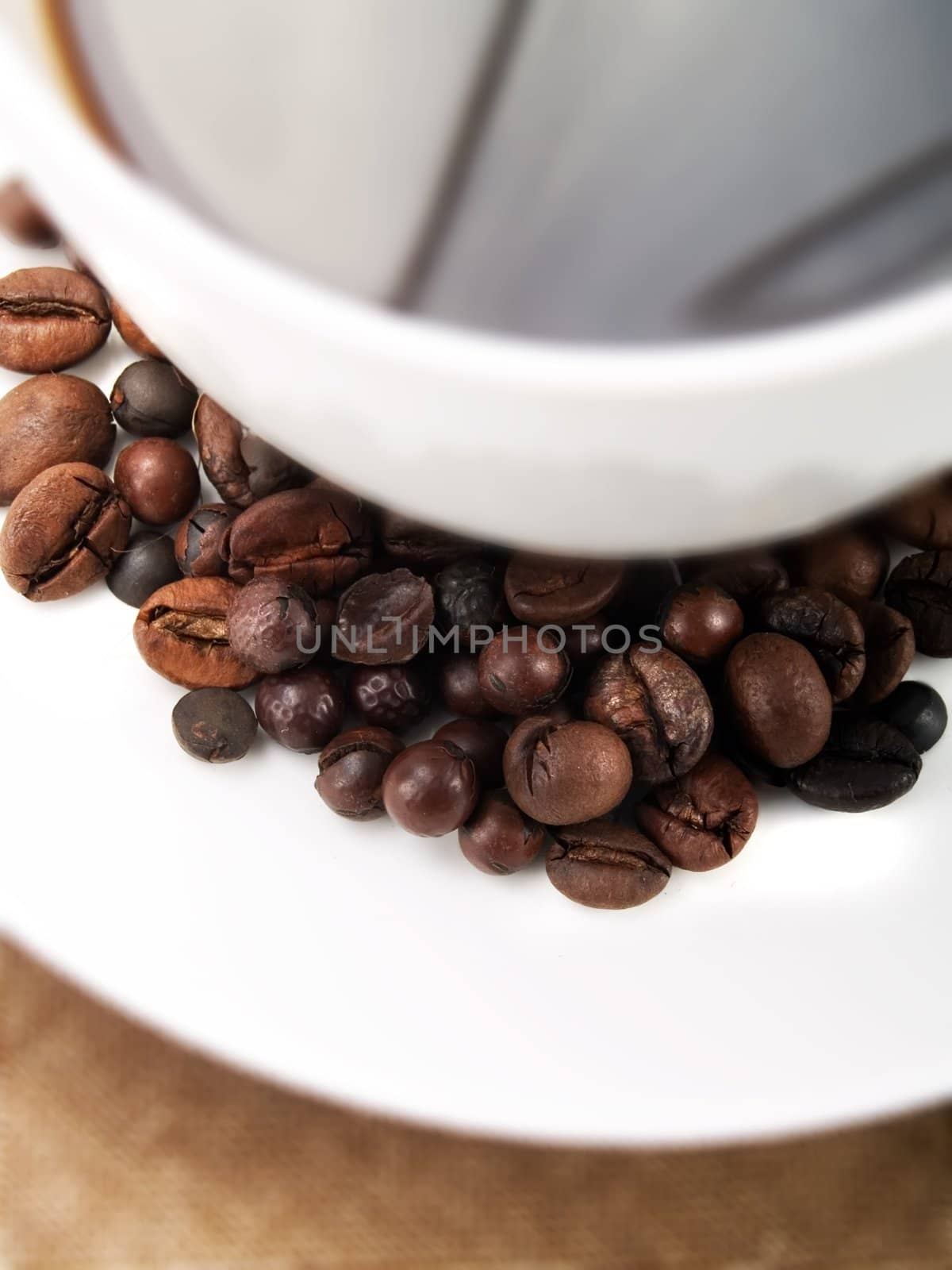 Coffee beans on a coffee cup