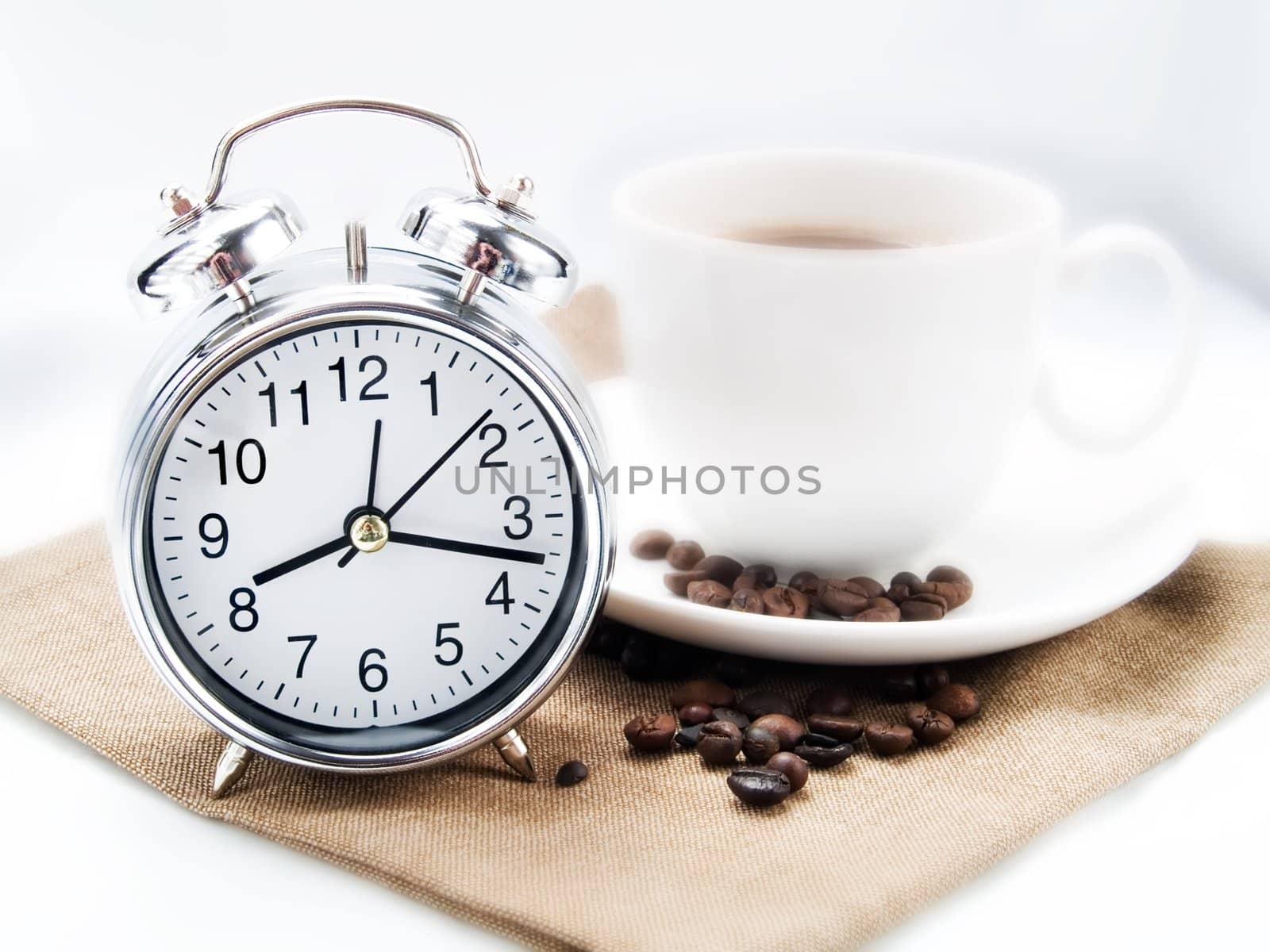 Alarm clock and coffee cup in a kitchen