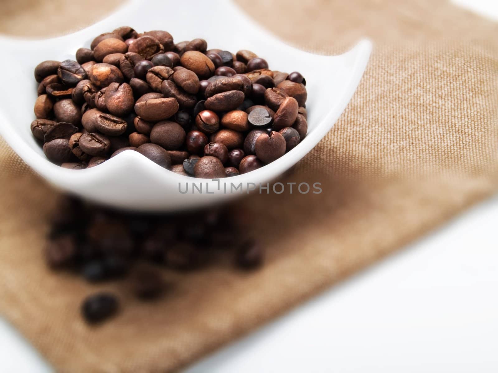 Coffee beans in a white plate