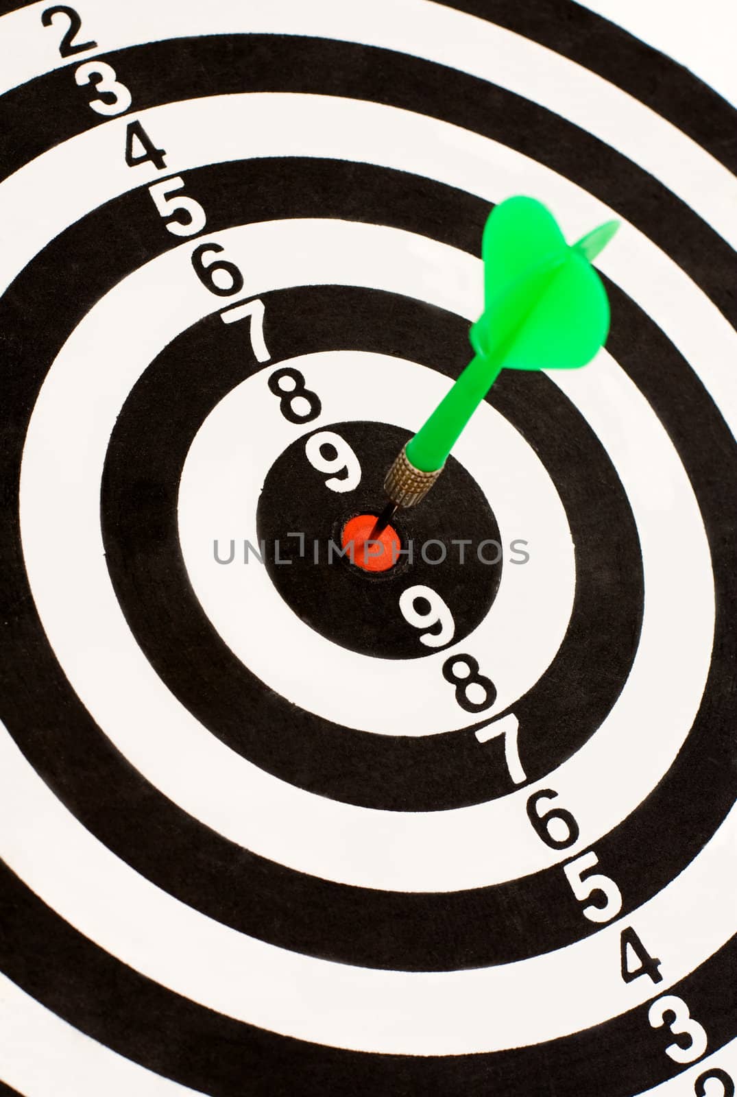 Green dart stuck in the center