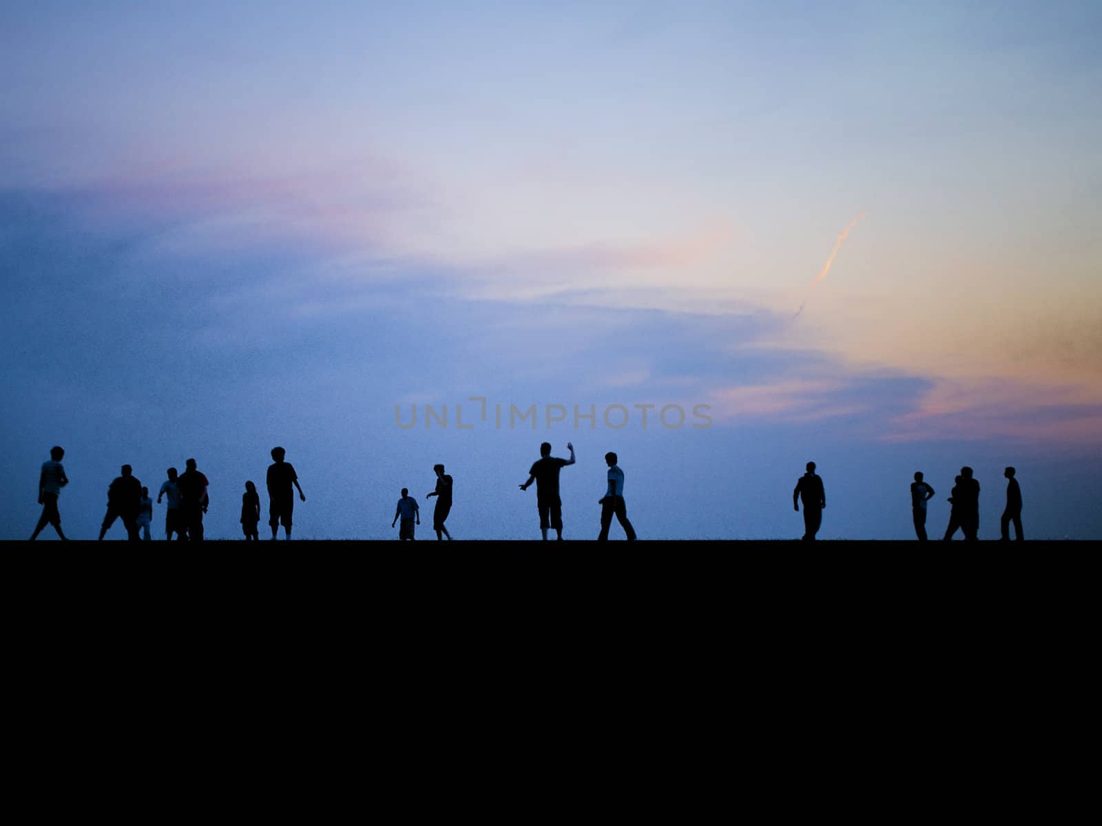 People Playing on Horizon at Dusk/Sunset by bobbigmac