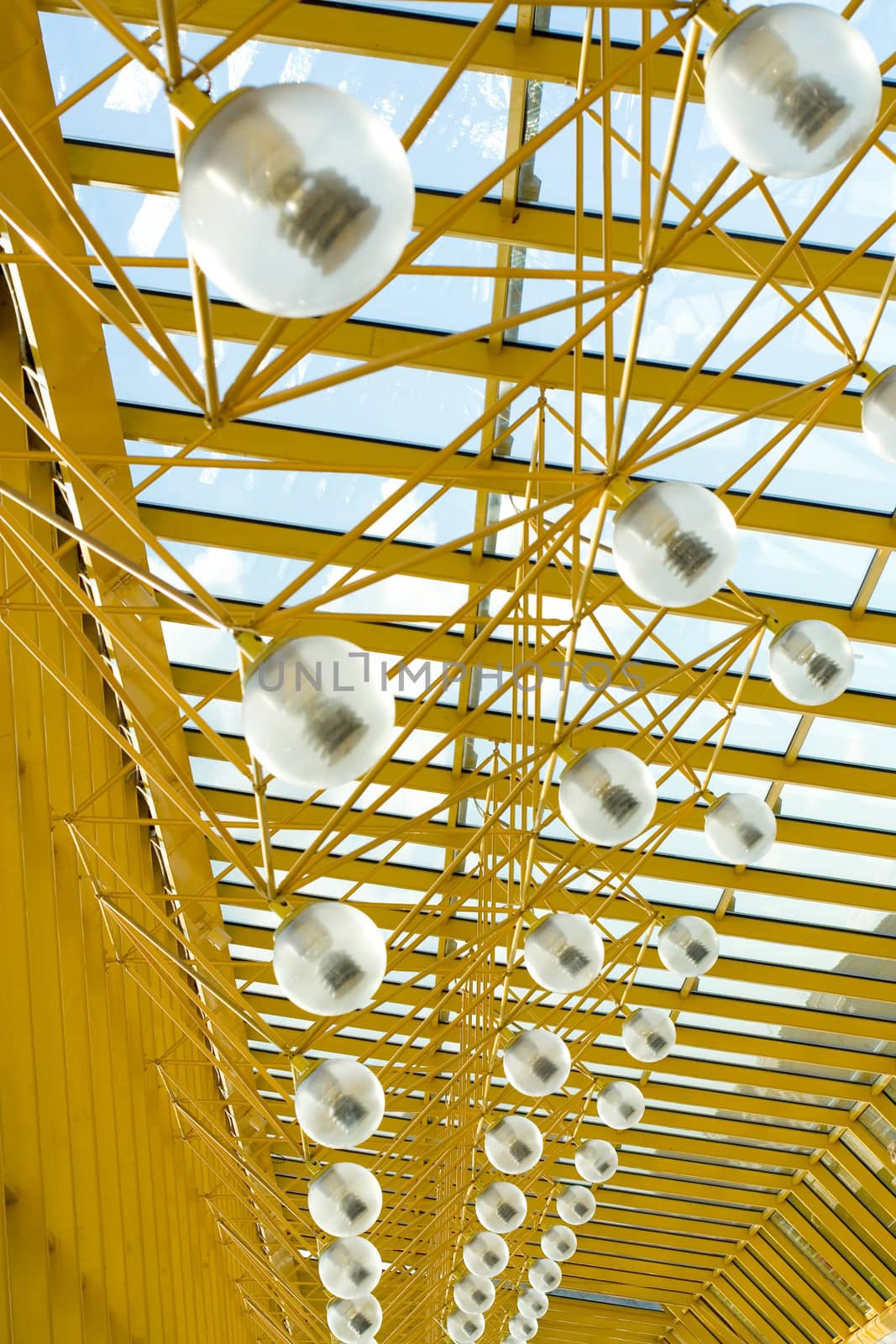 Glass and yellow metal interior construction